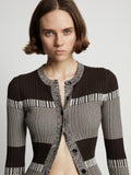 Detail image of model wearing Mini Stripe Cardigan in dark brown/off white
