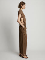 Side image of model wearing Side Slit T-Shirt in coffee