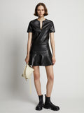 Front image of model wearing Faux Leather Ruffle Mini Dress in black