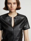 Detail image of model wearing Faux Leather Ruffle Mini Dress in black