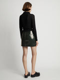 Back image of model wearing Vinyl Mini Skirt in pine