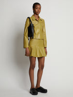Front image of model wearing Leather Ruffle Mini Skirt in sulphur