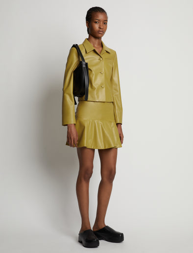 Front image of model wearing Leather Ruffle Mini Skirt in sulphur