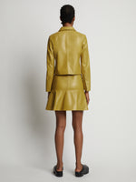 Back image of model wearing Leather Ruffle Mini Skirt in sulphur