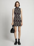 Front image of model wearing Printed Smocked Mini Dress in mint/black