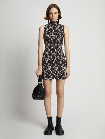 Front image of model wearing Printed Smocked Mini Dress in mint/black