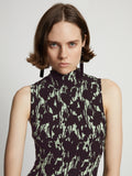 Detail image of model wearing Printed Smocked Mini Dress in mint/black