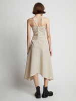 Back image of model wearing Gingham Ruched Strappy Dress in buttercream/fawn