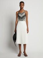 Front image of model wearing Marled Stripe Body Suit in buttercream/black