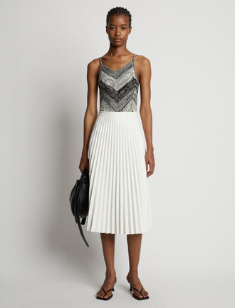 Front image of model wearing Marled Stripe Body Suit in buttercream/black