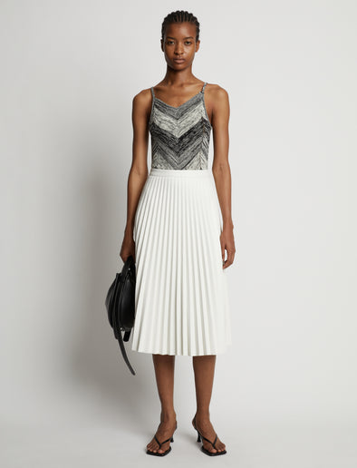 Front image of model wearing Marled Stripe Body Suit in buttercream/black