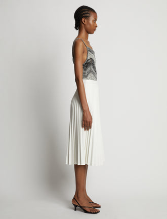 Side image of model wearing Marled Stripe Body Suit in buttercream/black