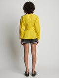 Back image of model wearing Poplin V-Neck Top in sun