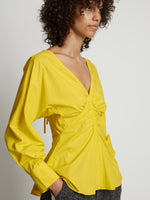Detail image of model wearing Poplin V-Neck Top in sun