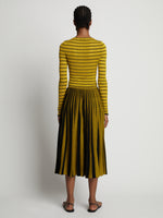 Back image of model wearing Sheer Stripe Sweater in sulphur/black