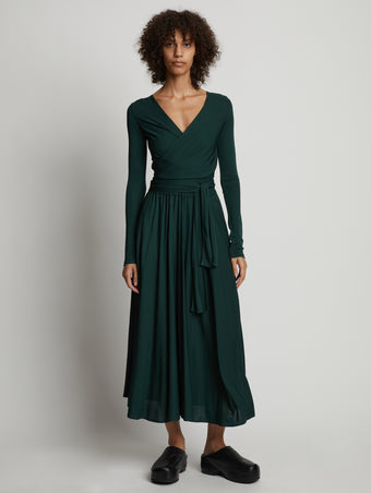 Front image of model wearing Matte Crepe Wrap Dress in pine