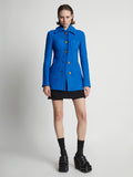 Front image of model wearing Boucle Tweed Jacket in turquoise