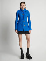 Front image of model wearing Boucle Tweed Jacket in turquoise
