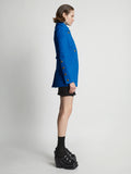 Side image of model wearing Boucle Tweed Jacket in turquoise