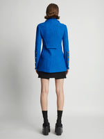Back image of model wearing Boucle Tweed Jacket in turquoise