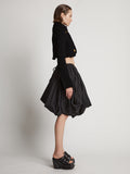 Side image of model wearing Boucle Tweed Crop Jacket in black