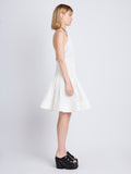 Side image of model wearing Stretch Nylon Dress in white