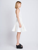 Side image of model wearing Stretch Nylon Dress in white