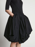 Detail image of model wearing Technical Nylon Skirt in black