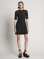 Front image of model wearing Lace Dress in black