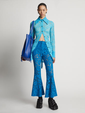 Front image of model wearing Lace Pants in turquoise