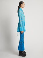 Side image of model wearing Lace Pants in turquoise