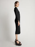 Side image of model wearing Viscose Knit Dress in black