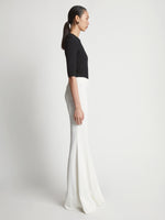 Side image of model wearing Viscose Tuxedo Stripe Pants in off white multi
