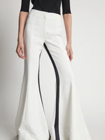 Detail image of model wearing Viscose Tuxedo Stripe Pants in off white multi