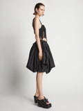 Side image of model wearing Technical Nylon Fringe Bra in black