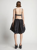 Back image of model wearing Technical Nylon Fringe Bra in black