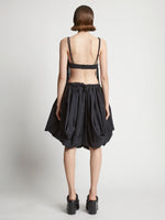 Back image of model wearing Technical Nylon Fringe Bra in black