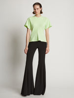 Front image of model wearing Eco Cotton Waisted T-Shirt in lime