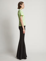 Side image of model wearing Eco Cotton Waisted T-Shirt in lime