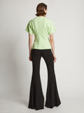 Back image of model wearing Eco Cotton Waisted T-Shirt in lime
