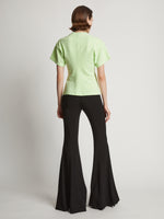 Back image of model wearing Eco Cotton Waisted T-Shirt in lime