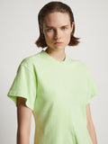 Detail image of model wearing Eco Cotton Waisted T-Shirt in lime
