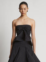 Cropped front image of model wearing Technical Nylon Strapless Top in black