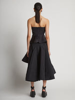 Back image of model wearing Technical Nylon Strapless Top in black