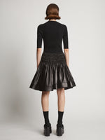 Back image of model wearing Nappa Skirt in black