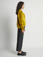 Side image of model wearing Tie Dye Sweatshirt in sulphur/muted lime