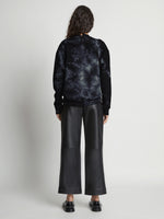 Back image of model wearing Tie Dye Sweatshirt in black/jade