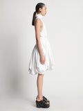 Side image of model wearing Technical Nylon Dress in optic white
