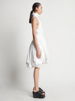 Side image of model wearing Technical Nylon Dress in optic white