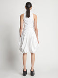 Back image of model wearing Technical Nylon Dress in optic white